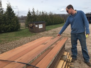 Klaas Armster reviewing reclaimed wood tank staves